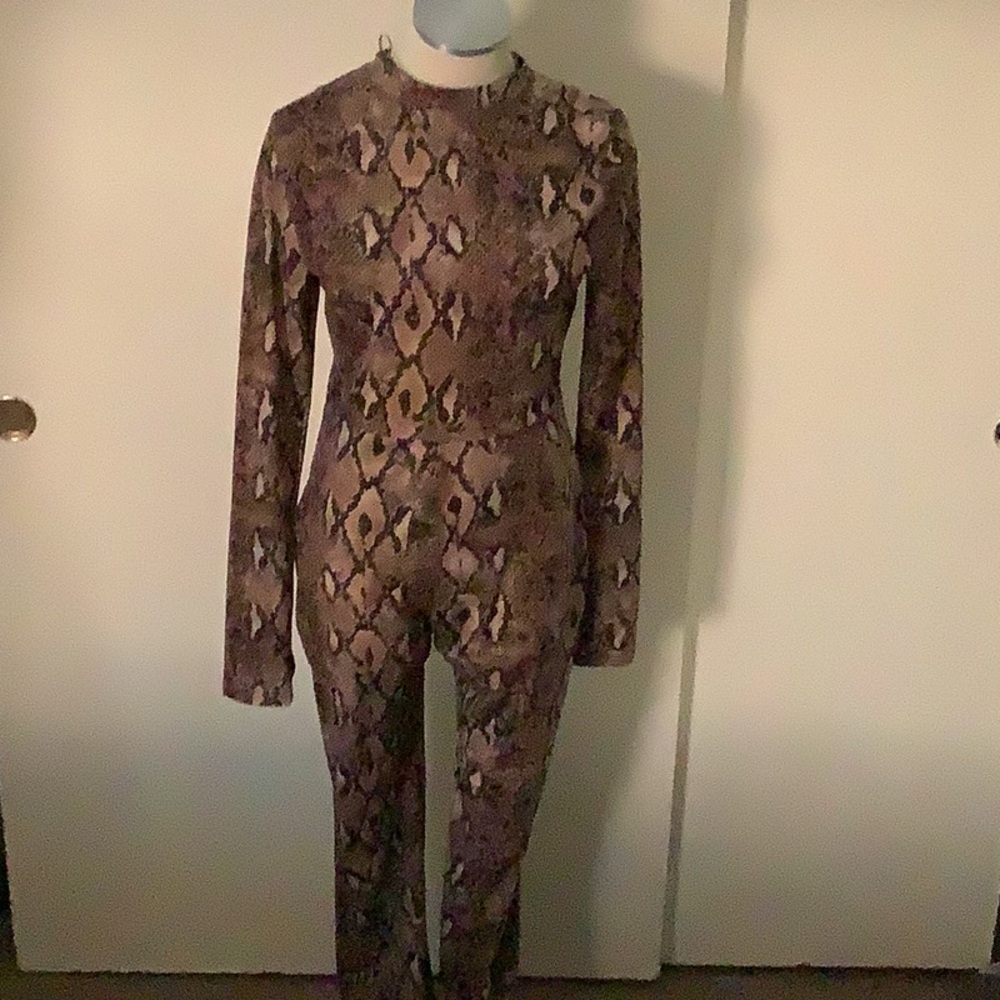 A brown,tan, and cream colored jumpsuit